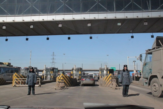 We are passing through the main gate of Tianjin Port, checkpoint to supervise each truck going in and out